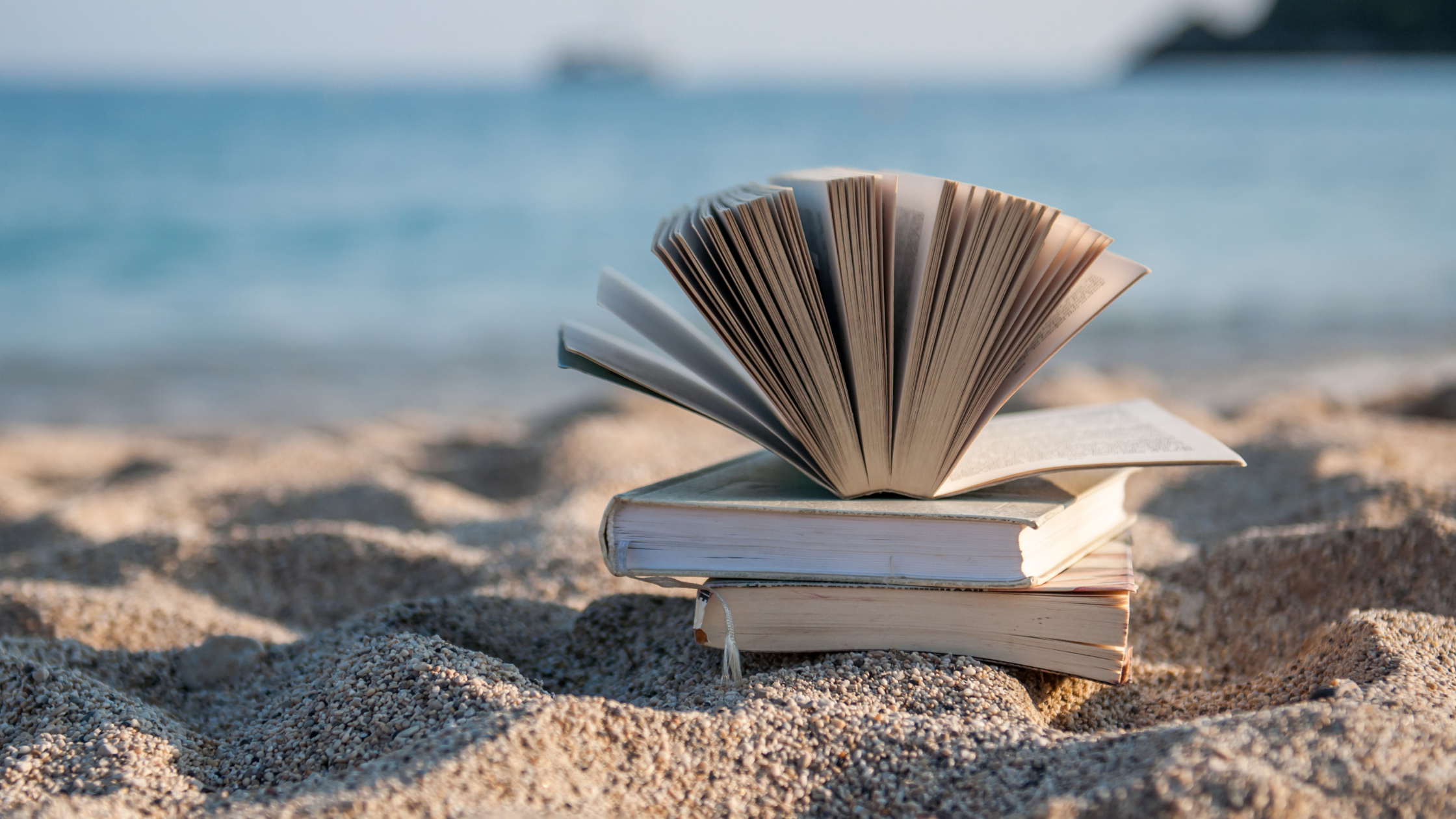 books on a beach to demonstrate different lifestyle possibilities after quitting your job 